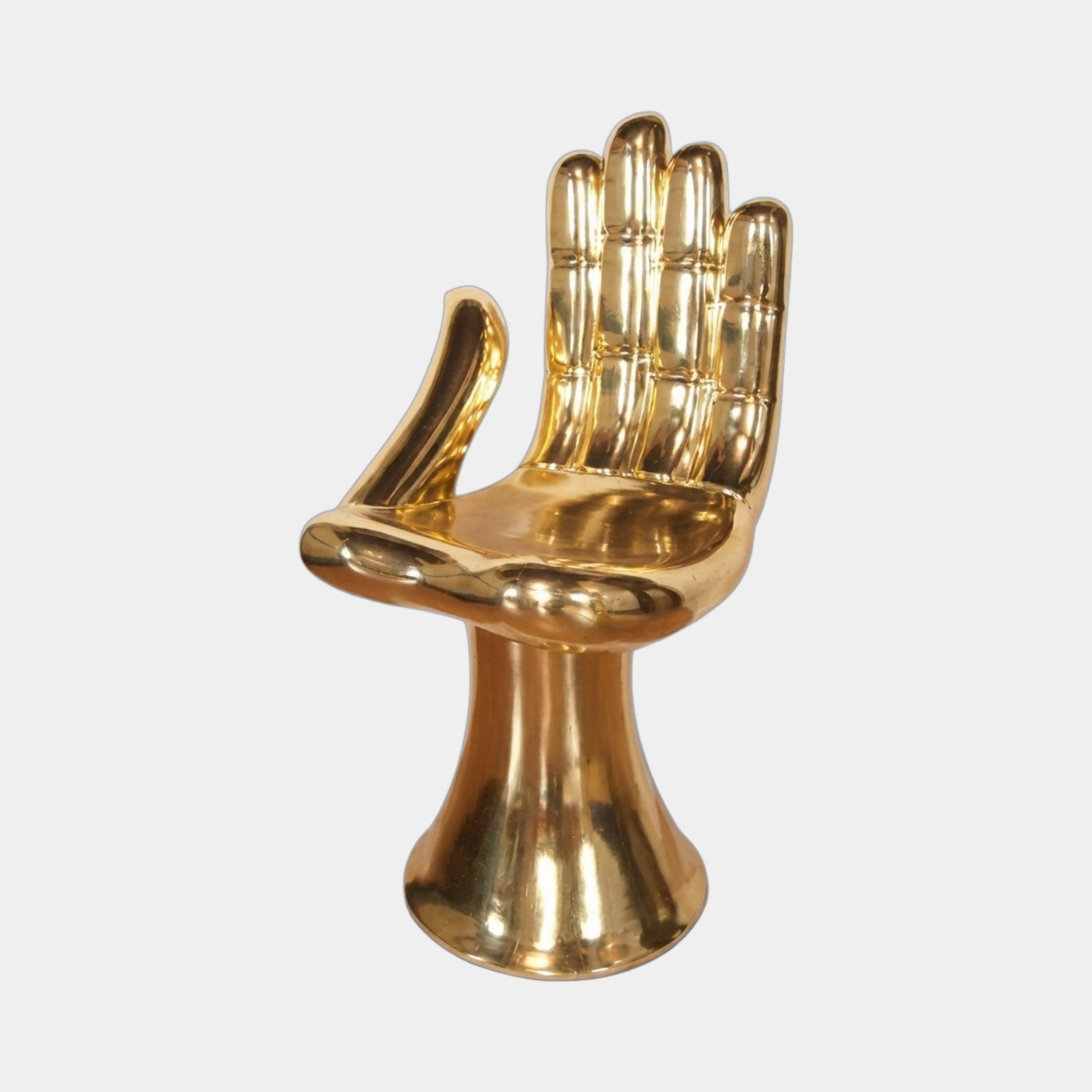 Contemporary Hand-Form Chair Bronze Sculpture by Giant Sculptures in mirror-polished gold, fingers forming the backrest on a flared pedestal, plain background.