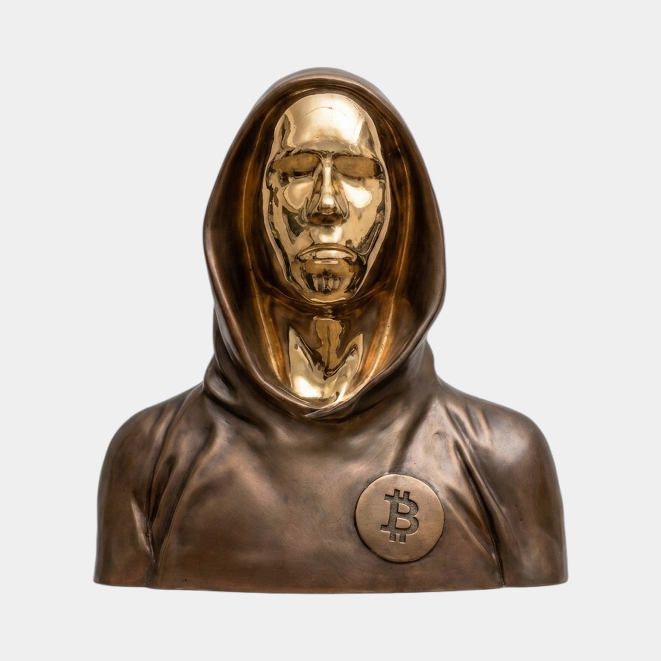 Contemporary Hooded Anonymous Bust Bronze Sculpture by Giant Sculptures, with brown-bronze hood and polished gold face and Bitcoin medallion, on a plain background.