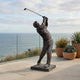 Giant Sculptures Contemporary Life-Size Male Golfer Bronze Sculpture 230cm shown mid follow-through swing on a seaside terrace beside potted succulents.
