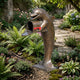 Contemporary Upright Dolphin Bronze Sculpture by Giant Sculptures, 170cm, shown upright on its tail with an open integrated mailbox in a garden path setting.