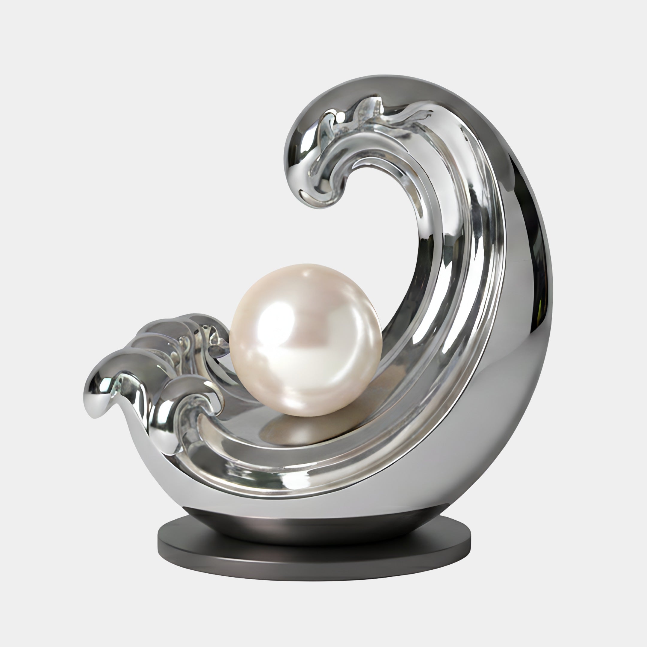 The Crescent Silver Wave Steel Sculpture (200cm) by Giant Sculptures features a sleek stainless steel wave embracing a glossy pearl on a round black base, displayed against a plain light gray backdrop.