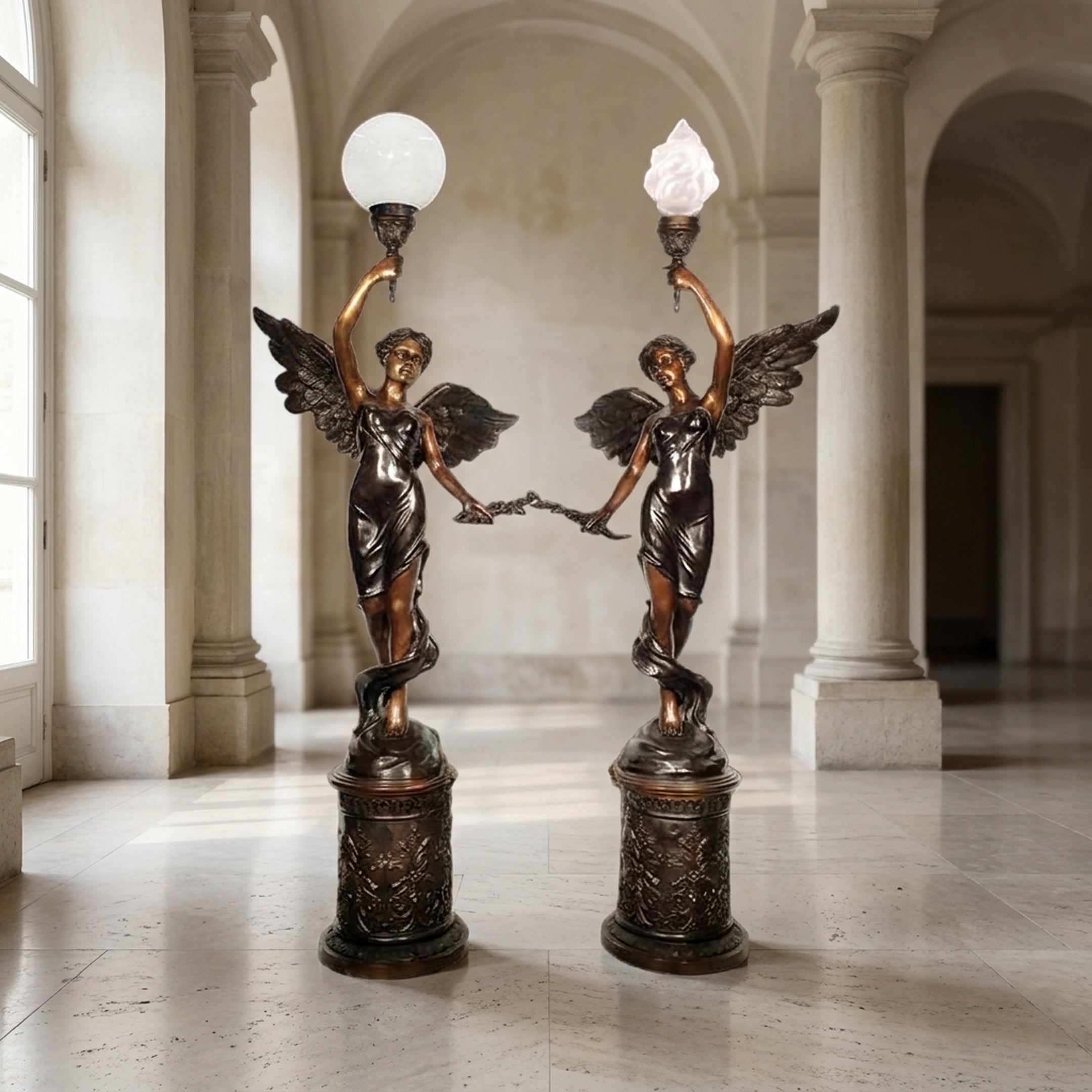 Large Classical Angel Torchiere Floor Lamp Bronze Sculpture by Giant Sculptures, a 240cm winged pair on plinths holding globe and flame lights in a marble hall.