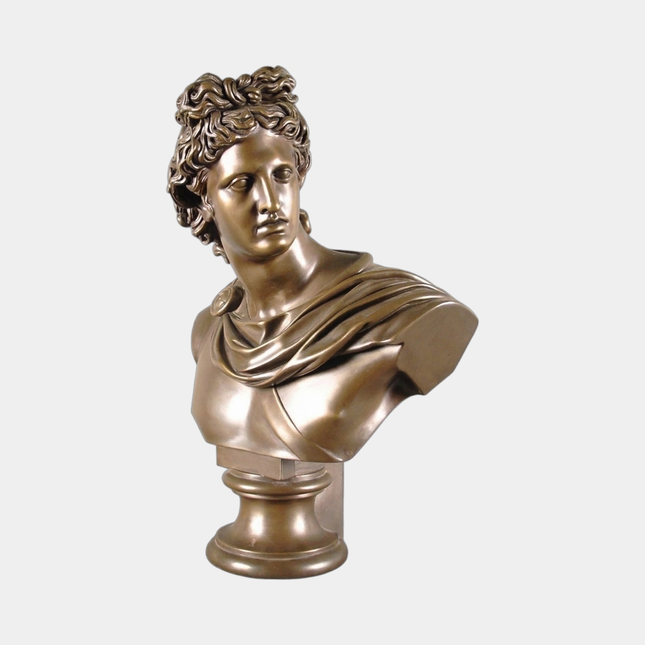 Large Classical Apollo Bust Bronze Statue 75cm by Giant Sculptures, head turned in three-quarter view with curled hair and draped himation on a round pedestal.