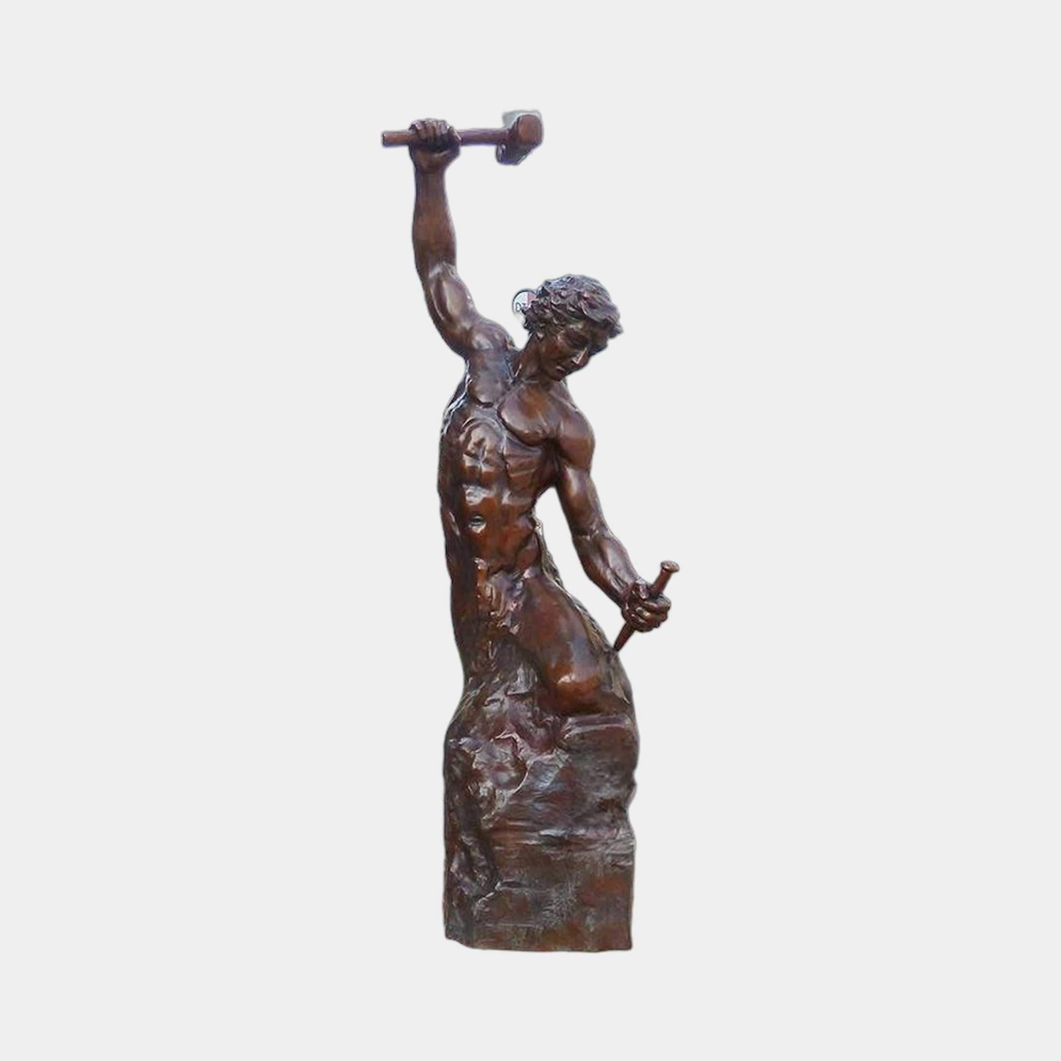 Giant Sculptures Large Classical Blacksmith Figure Bronze Sculpture 250cm, muscular nude male mid-strike with raised hammer on a rocky base, warm brown patina.