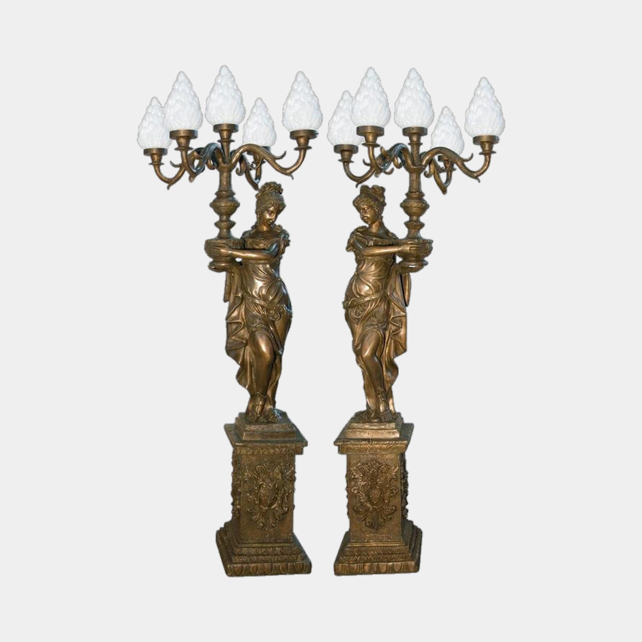 Large Classical Candelabra Figure Bronze Sculpture by Giant Sculptures, a 210cm pair of draped women on ornate pedestals holding five-arm flame-shade candelabra.