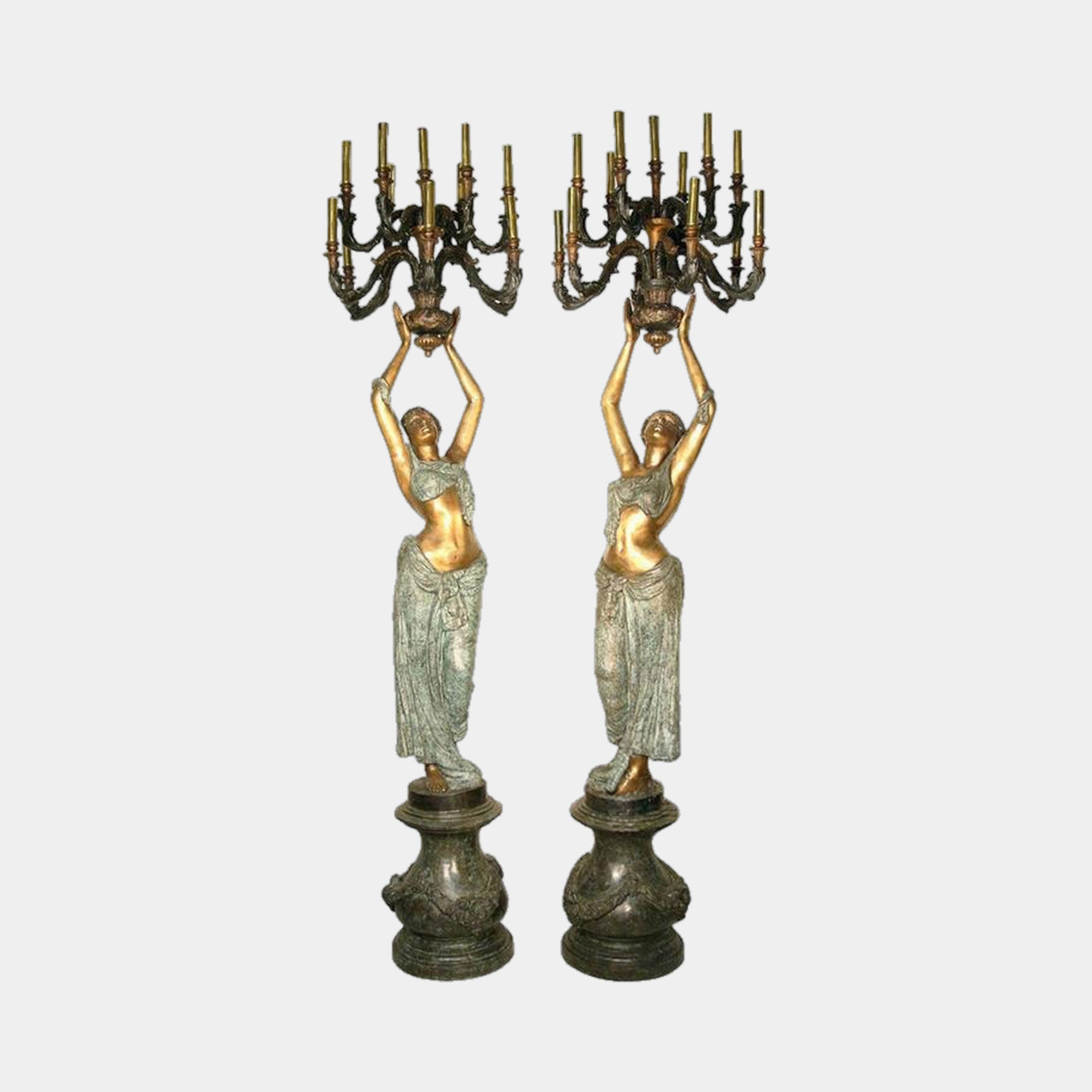 Pair of Large Classical Draped Goddess Candelabra Bronze Sculptures by Giant Sculptures, 220cm robed figures with gilded torsos and verdigris drapery, holding nine-arm candelabra aloft on ornate pedestals.