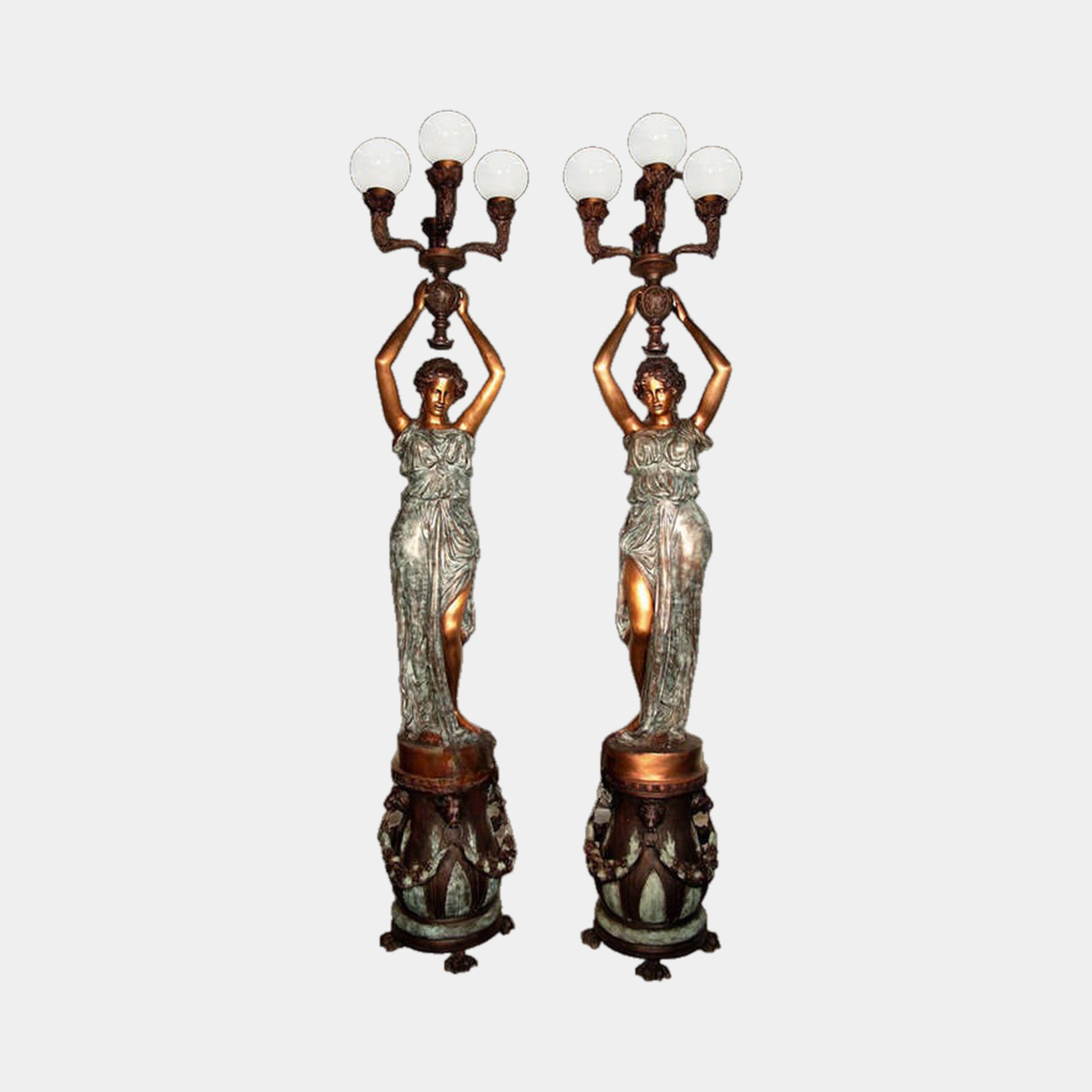Giant Sculptures' Large Classical Draped Goddess Candelabra Bronze Sculpture 250cm, a symmetrical pair of robed figures with two-tone verdigris and copper patina holding globe-lit candelabras on relief pedestals.