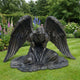 Large Classical Kneeling Angel Bronze Sculpture by Giant Sculptures in a dark patina, kneeling with head bowed and wings spread wide on a garden lawn.
