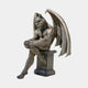 Large Classical Seated Gargoyle Demon Bronze Sculpture by Giant Sculptures, winged figure perched on a stepped plinth with stone-like patina, on grey.