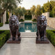 Large Classical Seated Lions Bronze Sculpture 130cm from Giant Sculptures, a matched pair in dark patina flanking a rectangular pool in an olive tree courtyard.