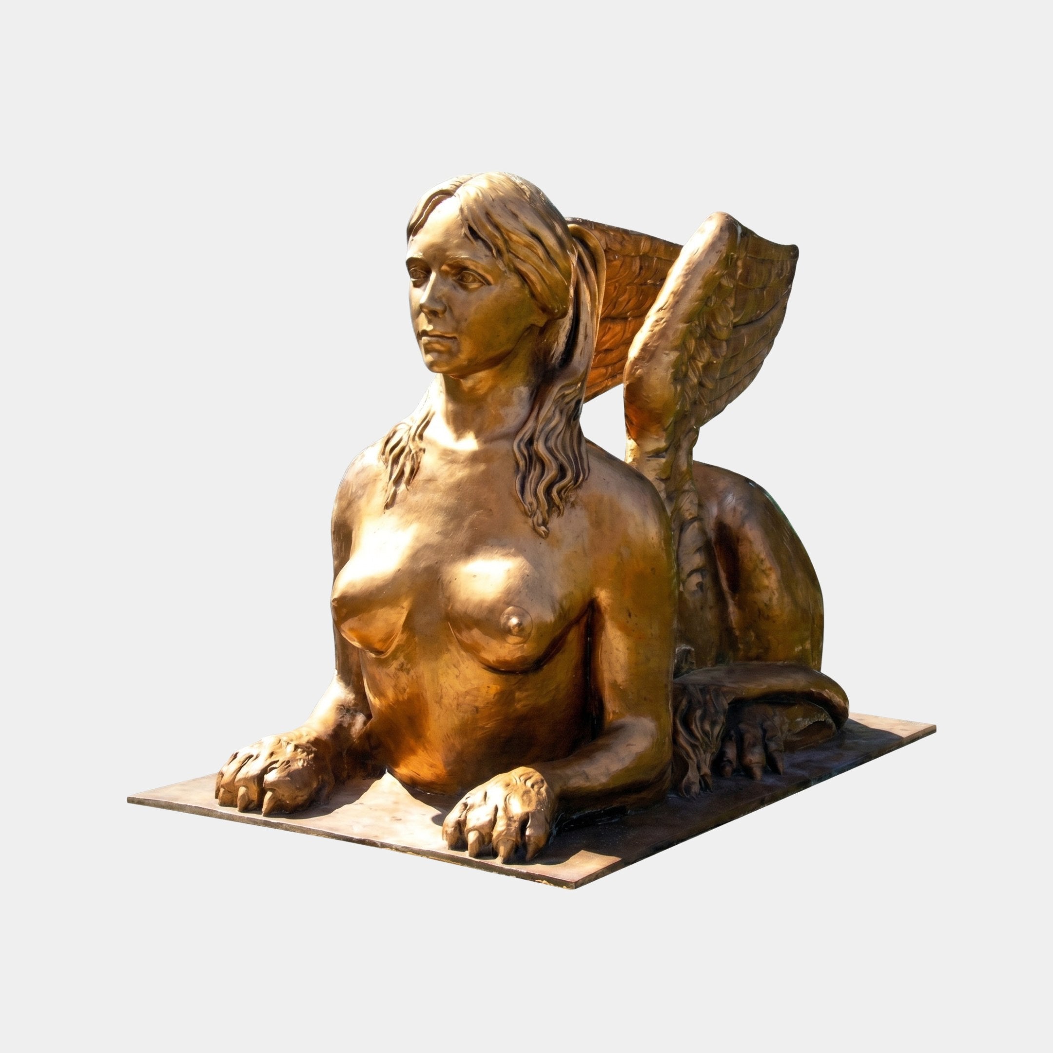 Large Classical Winged Sphinx Bronze Sculpture by Giant Sculptures in warm golden-amber patina, female torso and lion body with spread wings, on plain background.
