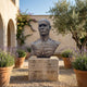 Large Contemporary Anatomical Male Bust Bronze Sculpture by Giant Sculptures on a travertine plinth in a Mediterranean courtyard with lavender and olive tree.