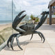 Large Contemporary Crab Bronze Sculpture by Giant Sculptures, 150cm tall with both claws raised, dark grey-green patina, on a coastal terrace beside the sea.