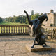 Giant Sculptures' 150cm Large Contemporary Great Dane Dog Bronze Sculpture with raised foreleg and head thrown back, dark patina, on a stone terrace by an estate.
