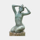 Large Contemporary Kneeling Female Figure Bronze Sculpture by Giant Sculptures, verdigris patina nude with arms raised to her head, on a carved stump base.