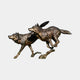 Large Contemporary Running Wolves Bronze Sculpture by Giant Sculptures, two wolves cast mid-stride with dark patina and gilded highlights on a plain background.