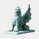 Large Heraldic Winged Lion-Dragon Gargoyle Bronze Sculpture by Giant Sculptures shown seated with wings spread, finished in verdigris green patina on a plain background.