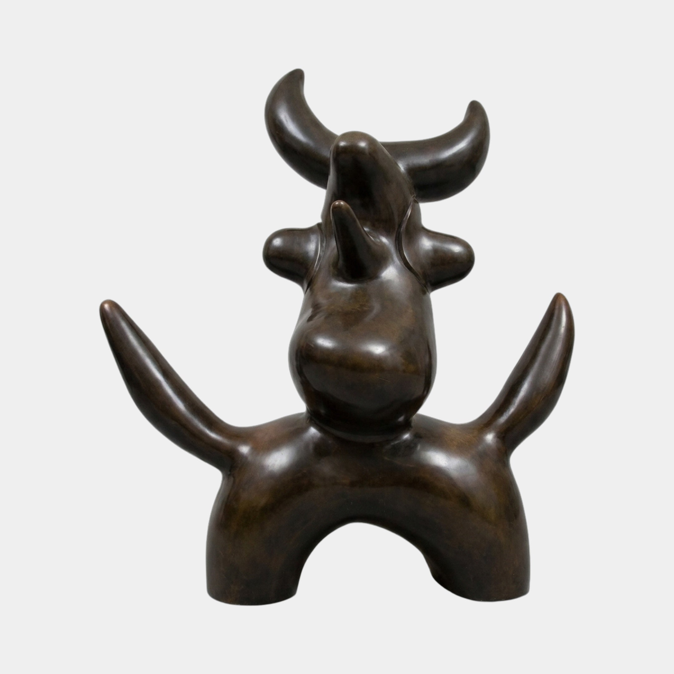 Large Modern Abstract Bull Bronze Sculpture by Giant Sculptures, front view showing rounded body, arched legs, and two sets of upward-curving horns in dark patina.