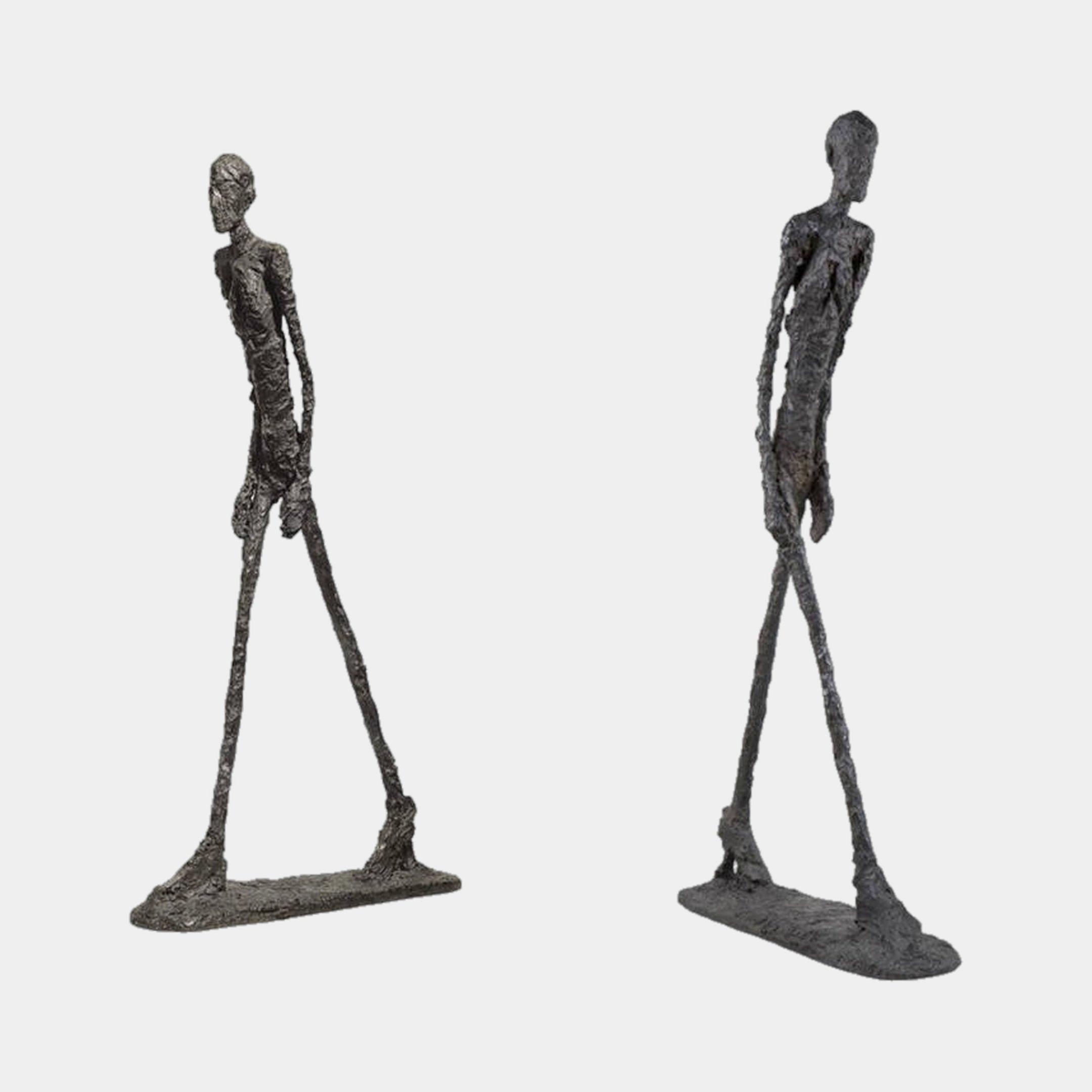 Two views of the Giant Sculptures Large Modern Elongated Walking Male Figure Bronze Sculpture, 200cm, showing the textured dark patina mid-stride on a plain background.