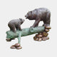 Large Traditional Bear and Cub Bronze Sculpture by Giant Sculptures, adult bear and cub facing each other on a verdigris log raised on bronze river stones.