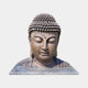 Large Traditional Buddha Head Bronze Bust 180cm by Giant Sculptures, front view with downcast eyes and spiral curls, on a pale stone plinth.