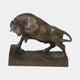 Large Traditional Charging Bull Bronze Sculpture by Giant Sculptures shown in side profile mid-lunge with lowered horns, warm brown patina, on a rocky rectangular plinth.