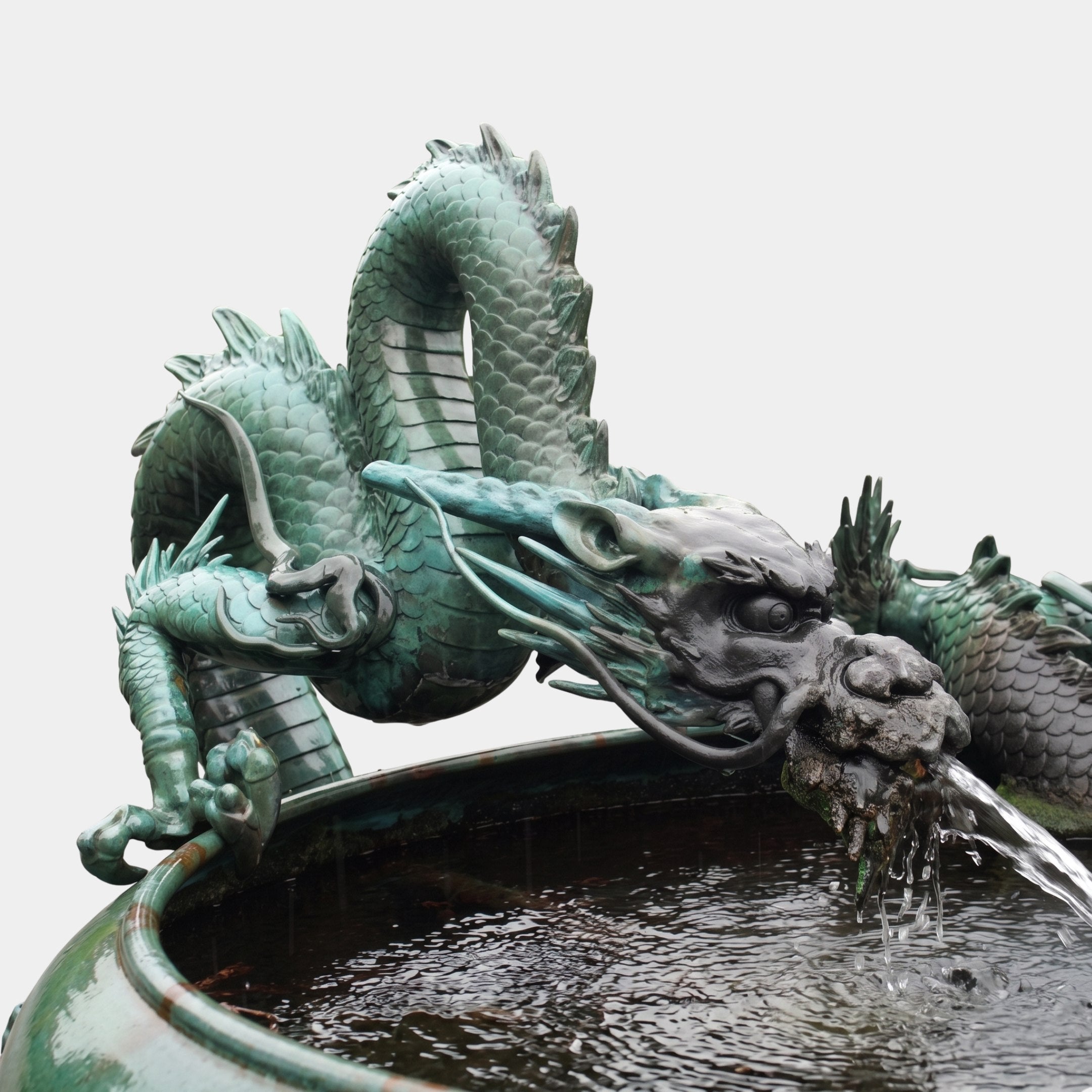 Giant Sculptures Large Traditional Coiling East Asian Dragon Bronze Fountain with verdigris patina, coiled along a stone basin rim, spouting water from its mouth.