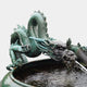 Giant Sculptures Large Traditional Coiling East Asian Dragon Bronze Fountain with verdigris patina, coiled along a stone basin rim, spouting water from its mouth.