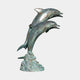 Giant Sculptures Large Traditional Leaping Dolphins Bronze Fountain with verdigris patina, two dolphins arcing from a sculpted wave base on plain background.