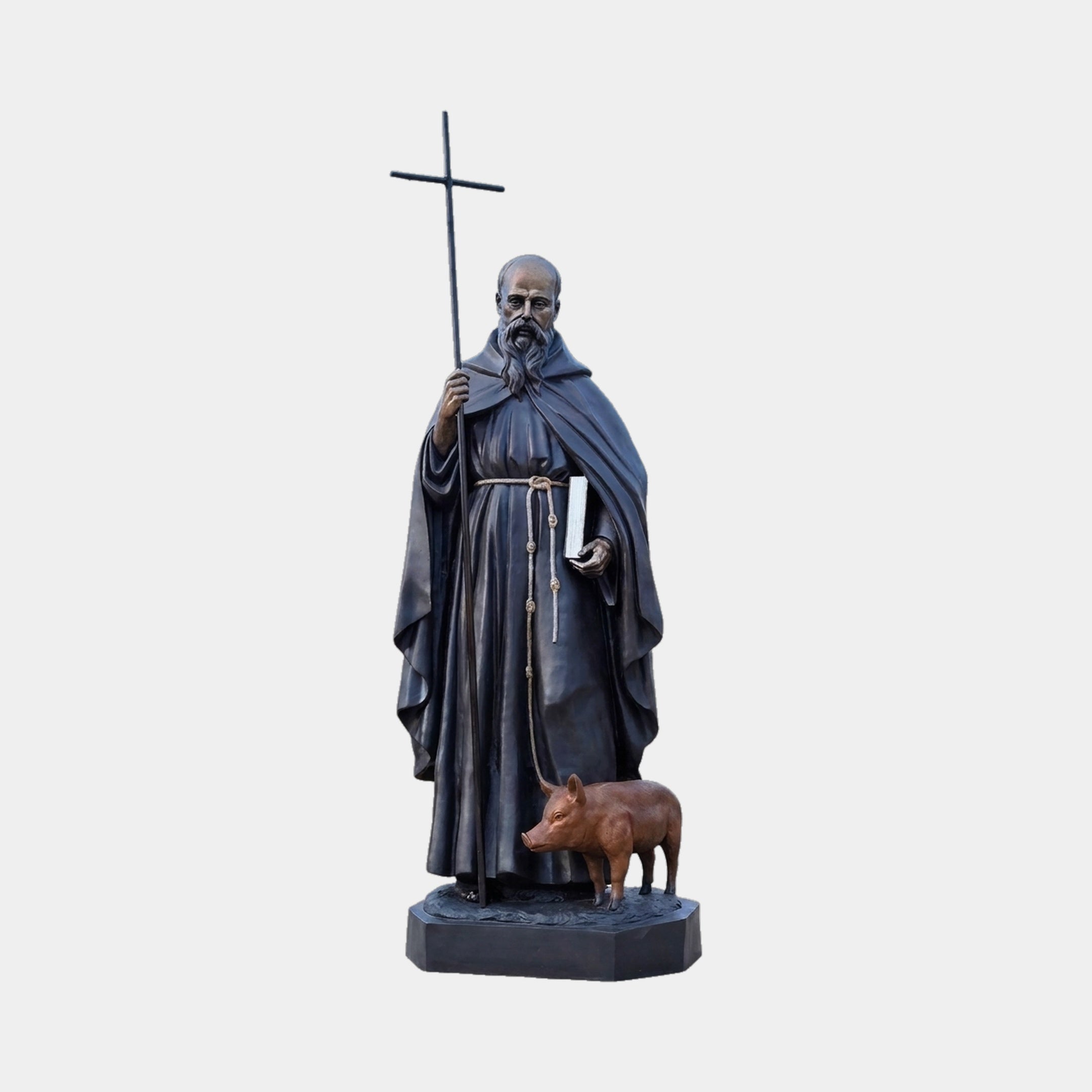 Large Traditional Robed Saint Bronze Statue by Giant Sculptures, 210cm bearded monk holding a cross staff and book with a reddish-brown pig at his feet.