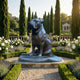Large Traditional Seated Bulldog Bronze Sculpture by Giant Sculptures, dark patinated finish, displayed on a stone plinth in a formal cypress and rose garden.