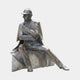 Giant Sculptures Large Traditional Seated Contemplative Figure Bronze Sculpture 180cm, seated man in deerstalker cap with pipe and document, on plain background.