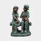 Giant Sculptures' Large Traditional Two Children and Dog Bronze Sculpture in verdigris green with bronze highlights, showing a girl with hat and boy holding a dog on a bench.