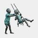 Life-Size Children on Swing Bronze Sculpture by Giant Sculptures showing a boy pushing a seated girl on a rope swing, verdigris patina, plain background.