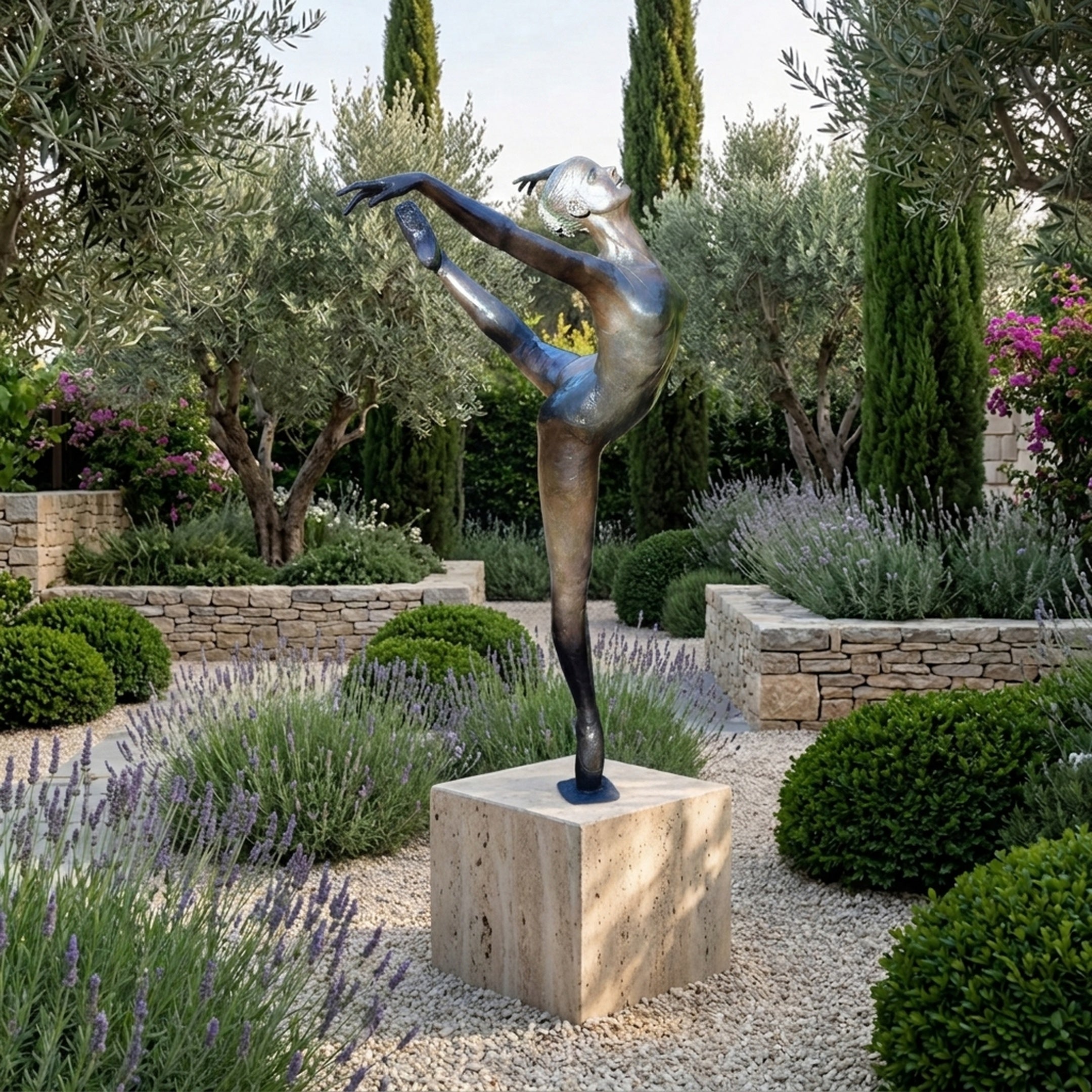 Life-Size Classical Female Ballet Dancer Bronze Sculpture by Giant Sculptures in arabesque penché on a stone plinth in a lavender and olive garden.