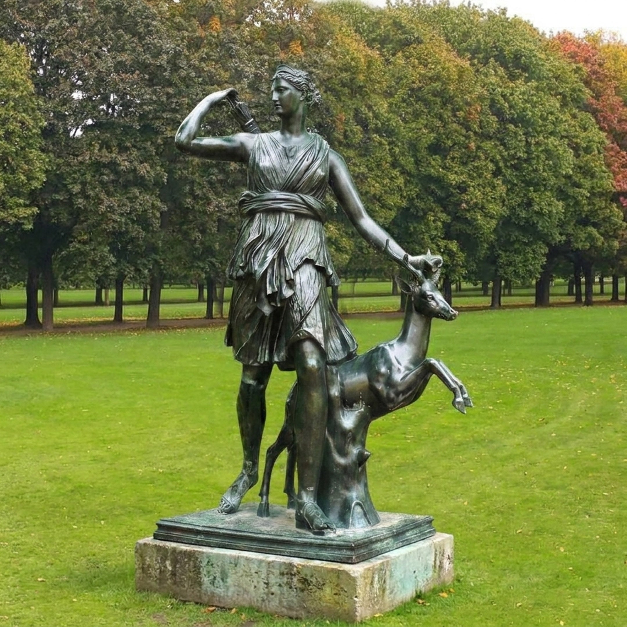 Life-Size Classical Goddess and Deer Bronze Sculpture by Giant Sculptures, 250cm, with verdigris patina, shown on a stone plinth in a parkland setting.