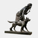 Life-Size Classical Hunter and Wolf Bronze Sculpture by Giant Sculptures, dark patina figure striding beside a wolf on a rectangular base, plain background.