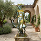 Life-Size Classical Nude Goddess with Greyhound Bronze Sculpture by Giant Sculptures in verdigris patina, displayed on a stone plinth in a Mediterranean courtyard.