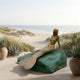 Life-Size Classical Reclining Mermaid Bronze Sculpture by Giant Sculptures, 200cm, with warm bronze figure and green verdigris rock on a seaside terrace.