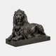 Life-Size Classical Recumbent Lion Bronze Sculpture by Giant Sculptures, shown in dark near-black patina with flowing mane and forelegs extended on a rectangular base.