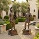 Life-Size Classical Roman Soldier Pair Bronze Sculpture by Giant Sculptures, 210cm warriors with spears and shields on plinths flanking a courtyard path.
