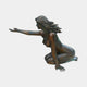 Life-Size Classical Seated Woman Bronze Sculpture by Giant Sculptures, side view of a kneeling nude with windswept hair and one arm extended, warm brown patina with green verdigris, on a plain background.