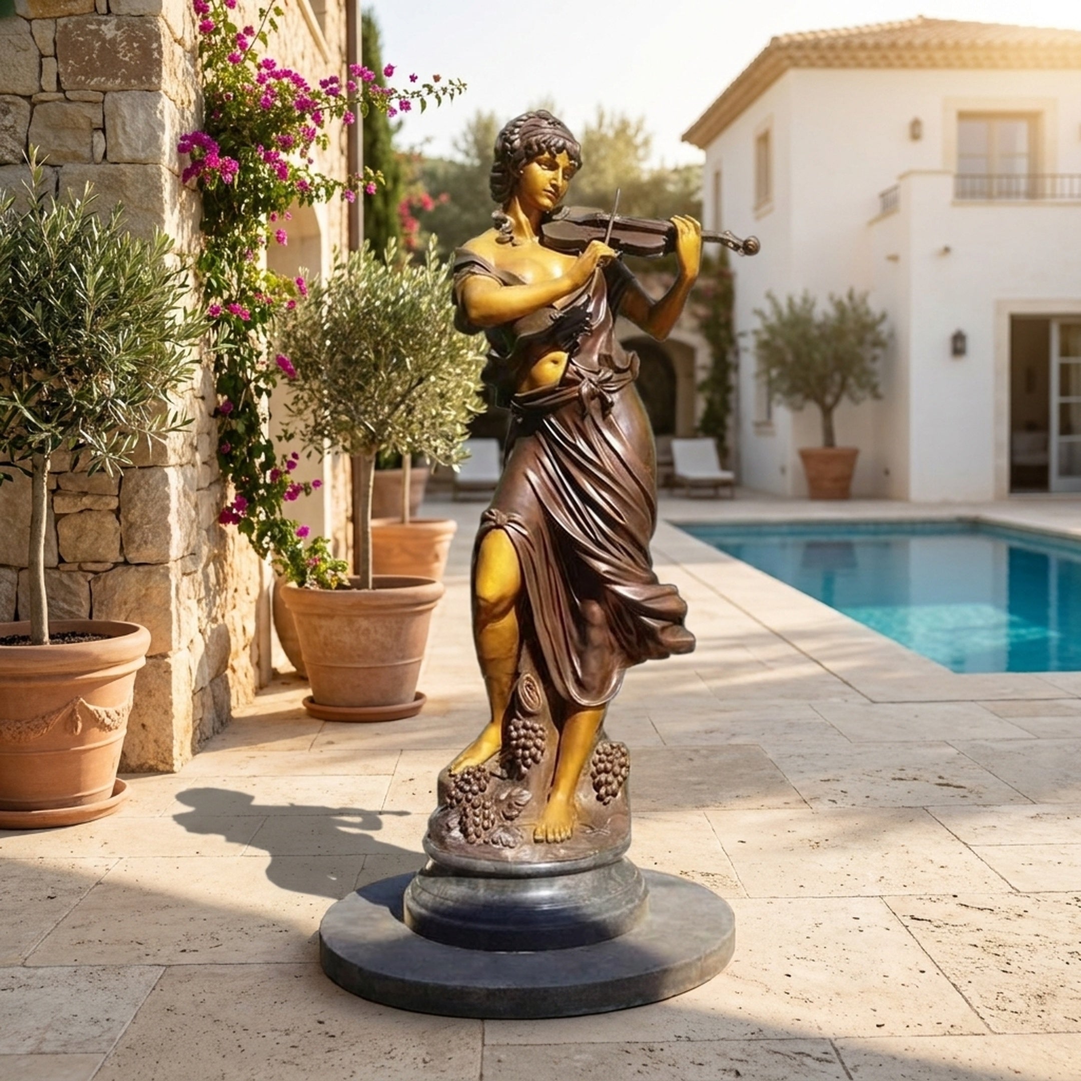 Life-Size Classical Violinist Bronze Sculpture by Giant Sculptures in two-tone gold and brown patina, displayed on a poolside terrace beside potted olive trees.