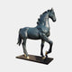 Life-Size Classical Walking Horse Bronze Sculpture by Giant Sculptures, 200cm, shown in side profile with arched neck, raised foreleg, dark blue-black patina and gold hooves on a black rectangular base.