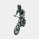 Giant Sculptures' Life-Size Contemporary Boy on BMX Bicycle Bronze Sculpture, 130cm, shown mid-wheelie with reversed cap and antique brown-green patina on a plain background.
