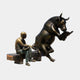 Life-Size Contemporary Bull and Man Reading Bronze Sculpture by Giant Sculptures, showing a dark patinated bull reading a book beside a golden-bronze seated man on a shared bench plinth.