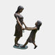 Life-Size Contemporary Children Bronze Statue companion piece by Giant Sculptures, showing a taller girl swinging a smaller girl by the hands, shown on a plain background.