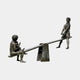 Life-Size Contemporary Children on Seesaw Bronze Sculpture by Giant Sculptures, dark patina finish showing three children at play, shown on a plain background.