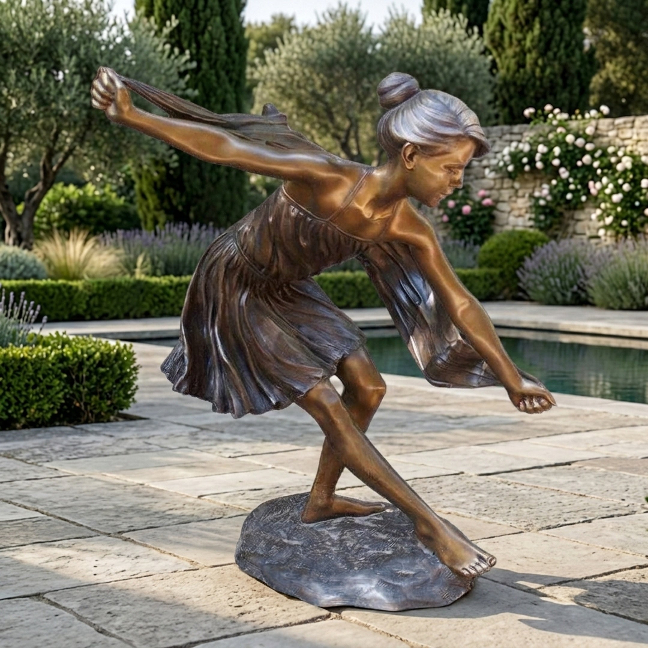 Life-Size Contemporary Dancing Girl Bronze Sculpture by Giant Sculptures, 160cm figure leaning forward with arms outstretched on a stone base beside a garden pool.