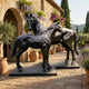 Life-Size Contemporary Horse Bronze Sculpture Pair by Giant Sculptures in high-gloss black on rectangular plinths, displayed on a Mediterranean stone terrace.